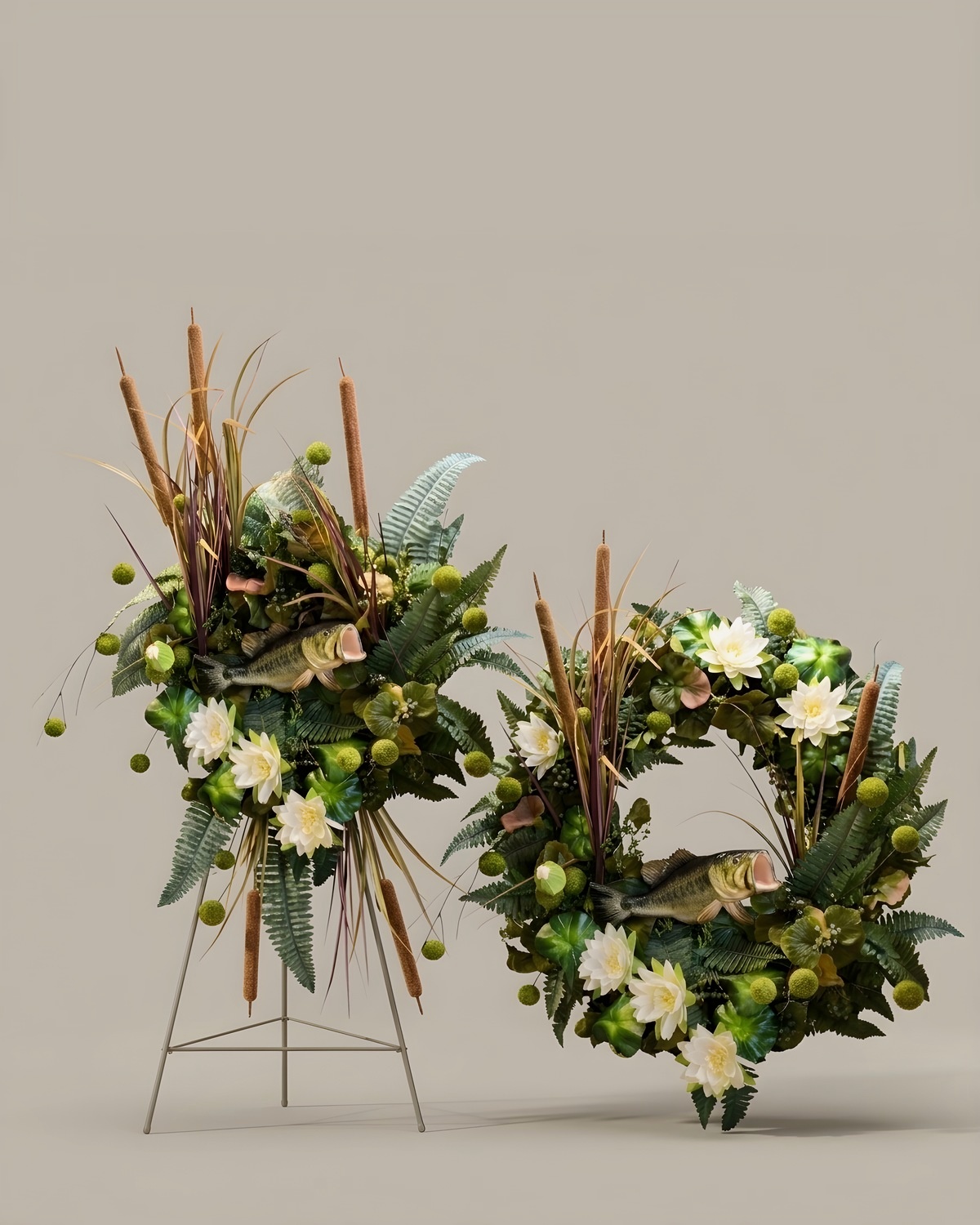 Cattail and fern sympathy tribute with a fish and a matching wreath