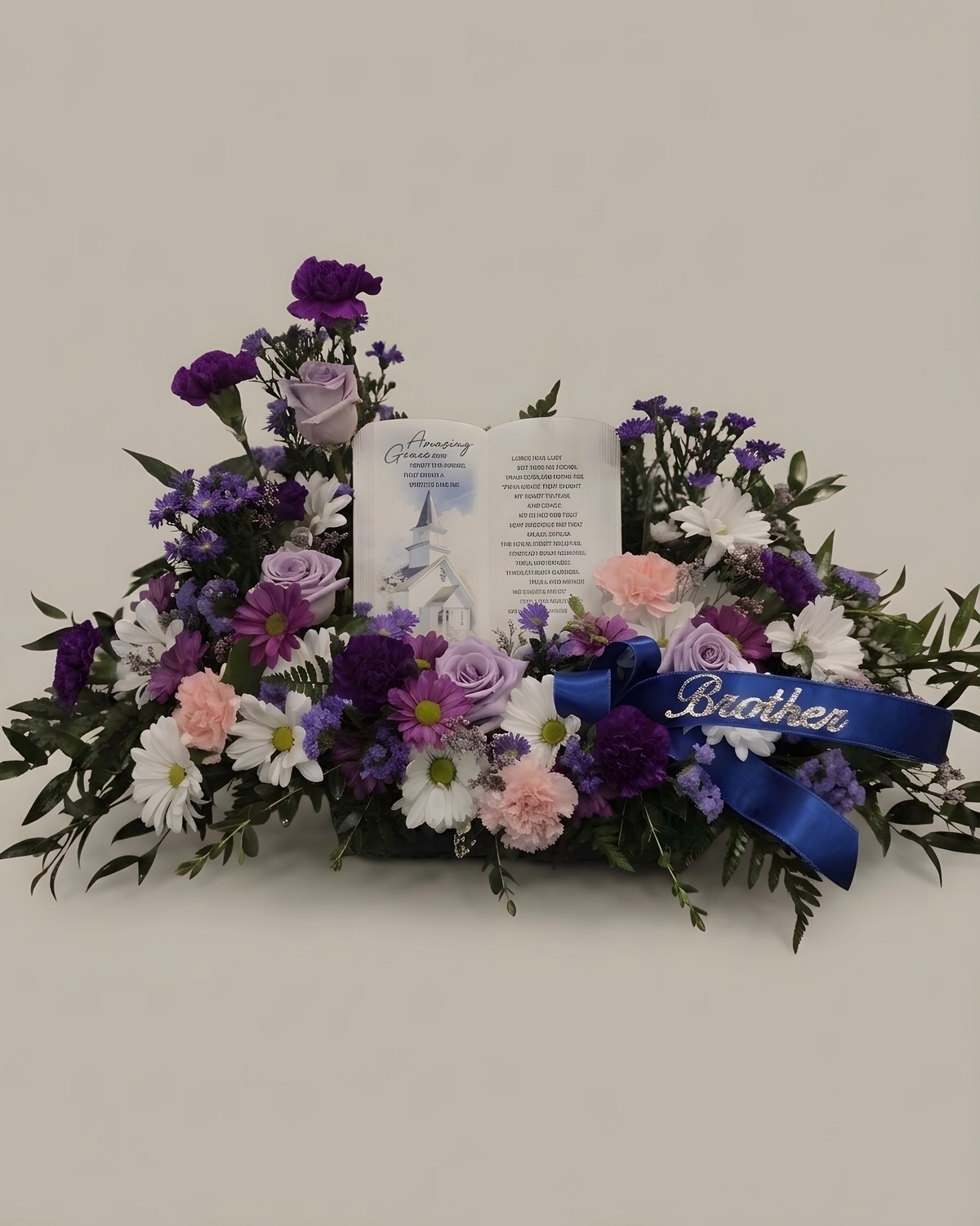 Purple and lavender blooms around an open keepsake book
